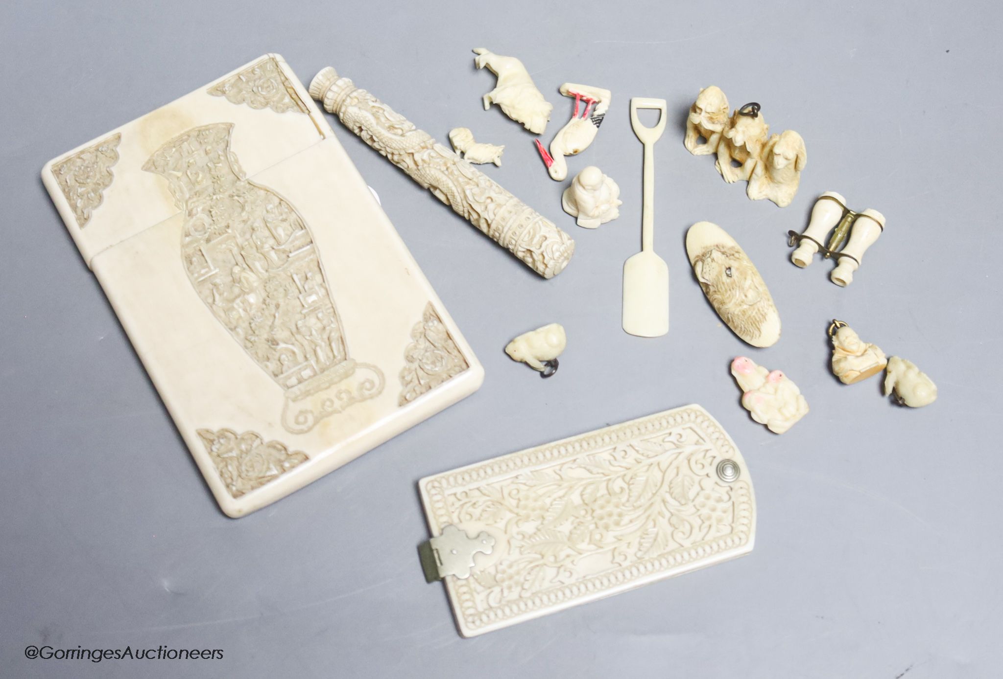 A late 19th century Chinese carved ivory card case, a similar needle case, an aide-memoire and sundries